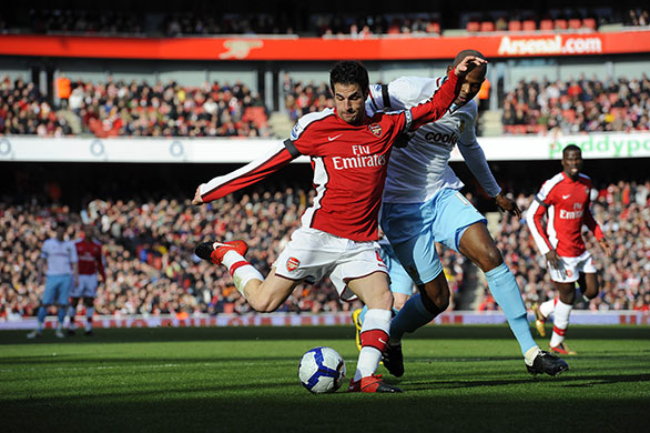 Arsenal v Burnley: Fabregas muscles past Cort in order to get a shot in