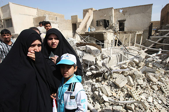 Elections in Iraq: Women weep at the scene of an explosion at Kre'at