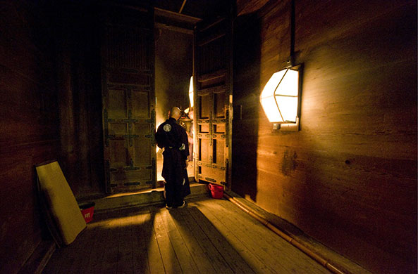 24 hours in pictures: Nara, Japan: A Buddhist monk guards the entrance to the Nigatsudo Hall