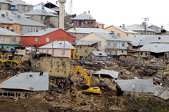 Turkey earthquake: Recue teams and villagers search for bodies among the ruins in Okcular