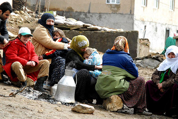 Turkey earthquake: Villagers wait near their destroyed houses in Okcular