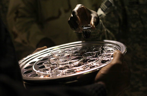24 hours in pictures: US troops communion during a Gospel church service in Afghanistan