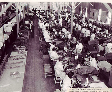 New Deal: Women work at sewing machines in large hall
