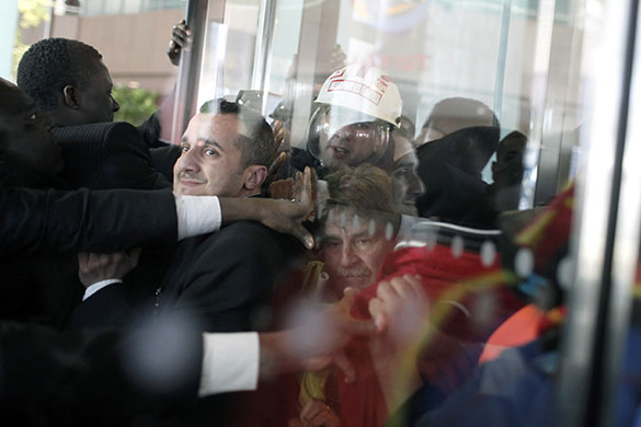 24 hours in pictures: Paris, France: Total employees invade the oil giant's headquarters