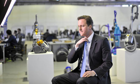 08/03/10b: David Cameron prepares for a TV interview at the Dyson factory.