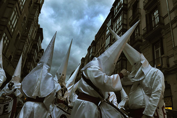 Holy week: Bilbao, Spain: Penitents prepare their costumes before a procession