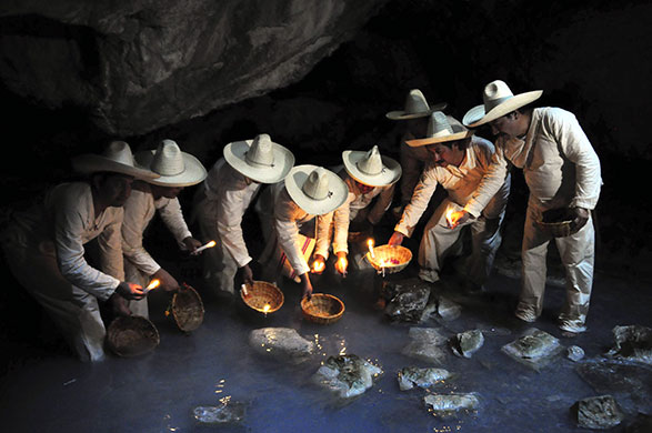 Holy week: Indigenous Zoque men carry baskets during a Holy week ritual
