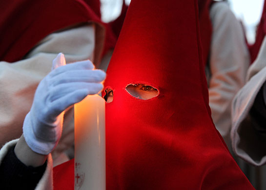 Holy week: Zamora, Spain:  A young penitent of the Cofradia del Silencio