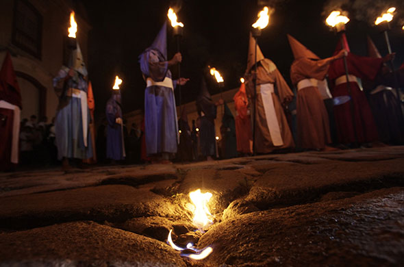 Holy week: Cidade de Goias, Brazil: Penitents attend the Procession of the Torches