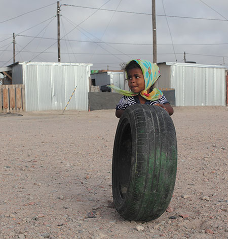 Blikkiesdorp, Cape Town: A young child plays outside