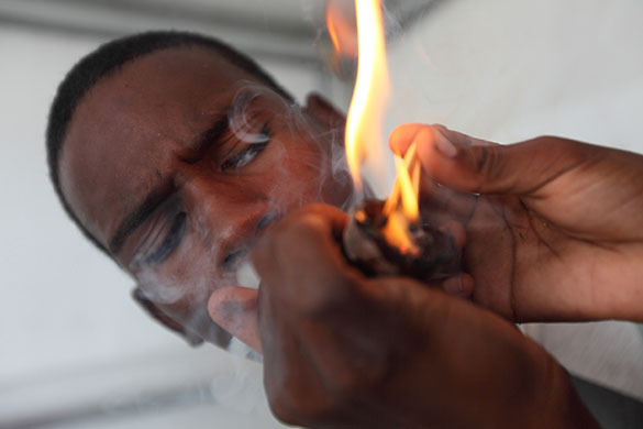 Blikkiesdorp, Cape Town: A local youth smoking Dagga