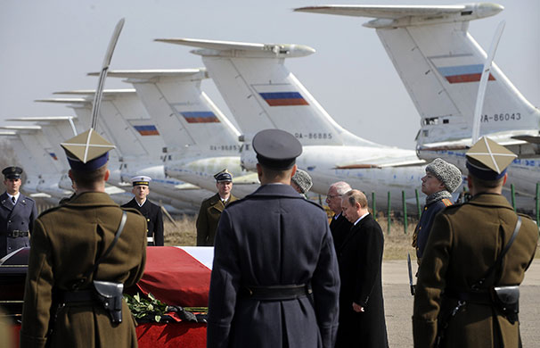 Poland in mourning : Russian Prime Minister Vladimir Putin stands next to the coffin 
