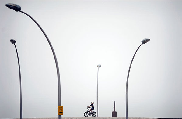 24 hours in pictures: Tel Aviv, Israel: A child rides a bicycle 