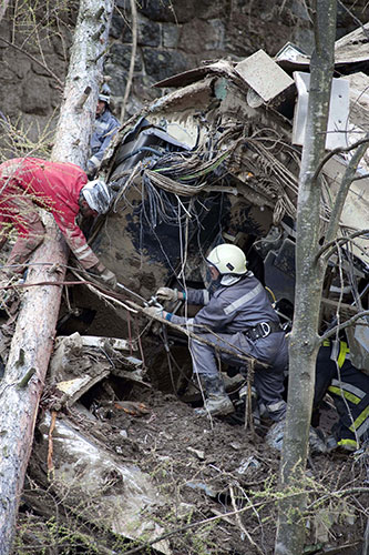 Train derailment: Firefighters inspect the wreckage of a derailed train near Merano