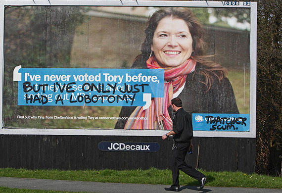 Election posters: Grafitti spray painted onto a Conservative Party election poster