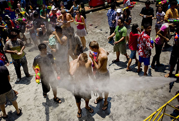 24 hours in pictures: Bangkok, Thailand: People are sprayed with water during Songkran festival