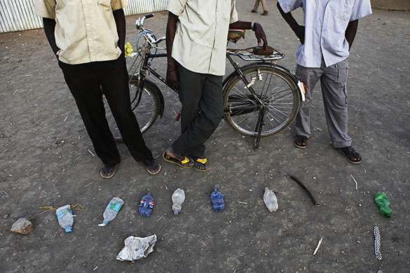 Sudan elections: Voters' items to mark their places in the queue in Malakal