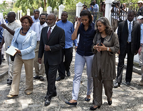 Michelle Obama in Haiti: Michelle Obama, president Rene Preval and his wife Elisabeth Debrosse