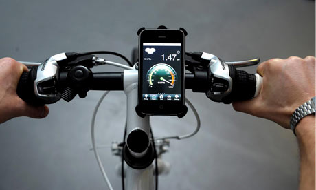 An iPhone attached to the handlebars shows how much power is being fed into the hotels system