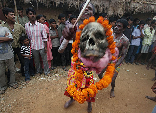 24 hours in pictures: Kurmun, India: Hindus dance celebrate the Shiva-Gajan festival 