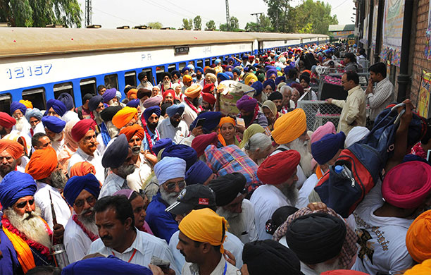 Sikh festivals: A crowd of Sikh pilgrims arrive from India at Wagah railway station