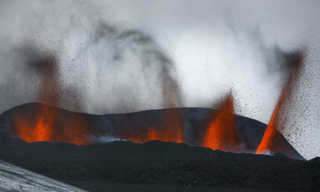Lava spews out of a mLava spews out from a mountain in the Hvolsv llur region of Iceland