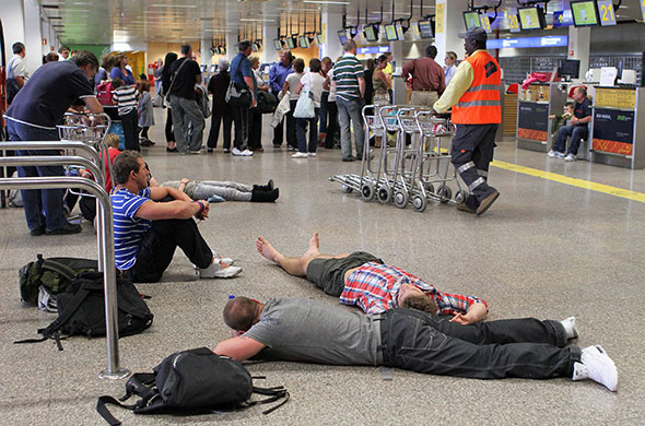 Volcano disruption: Passengers wait at Faro airport in Portugal
