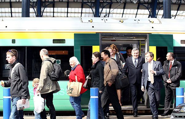 Election week two: Gordon Brown and wife Sarah Brown arrive at Brighton Station
