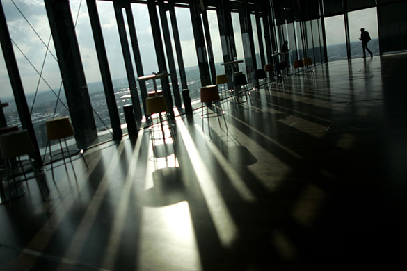 24 hours in pictures: Belgrade, Serbia: A man walks into a coffee shop on top of a high rise