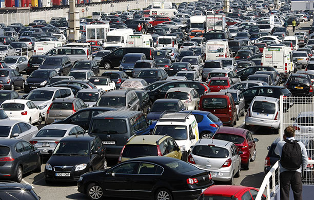 Travel chaos: Cars wait at a departure point at the car ferry terminal in Calais, France 