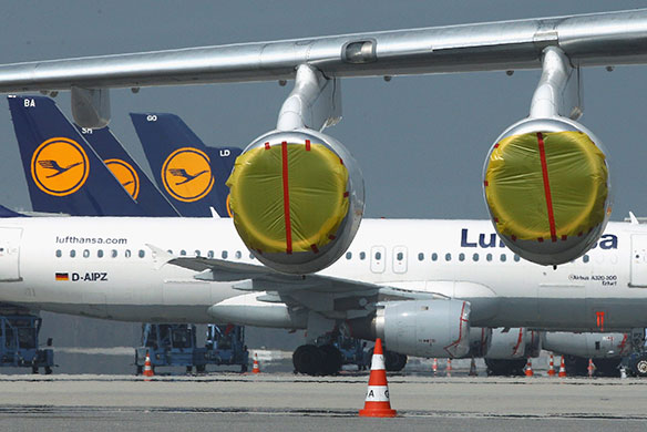Travel chaos: Lufthansa planes parked with plastic covers on engines at Munich Airport