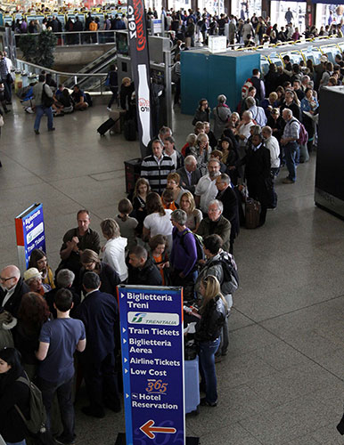 Travel chaos: People queue to buy tickets at Termini central train station in Rome, Italy