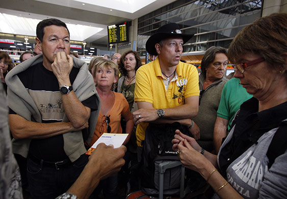 Travel chaos: Travellers at Los Angeles International Airport bound for Frankfurt react 