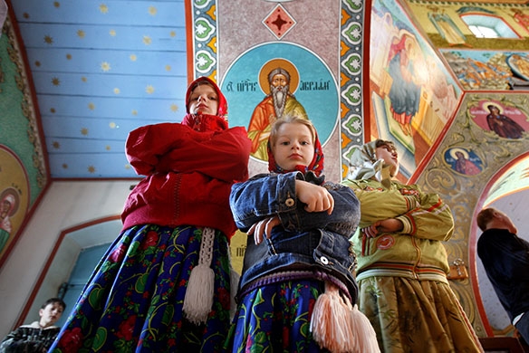 24 hours: Sarichioi, Romania: Ethnic Russian girls attend the Maundy Thursday service