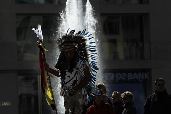 24 hours: Berlin, Germany: A man dressed as an American Indian Chieftain