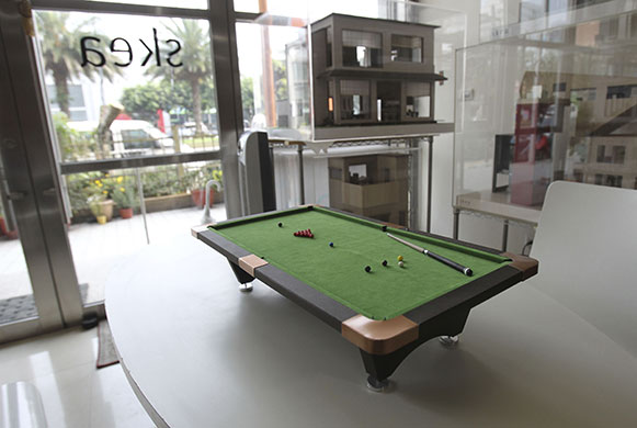 24 hours: Taipei, Taiwan: A model pool table is displayed in SKEA