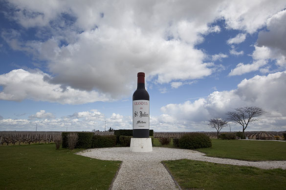 Wine tasting in Bordeaux: A large model of a wine bottle and vineyards near St Julien, Bordeaux