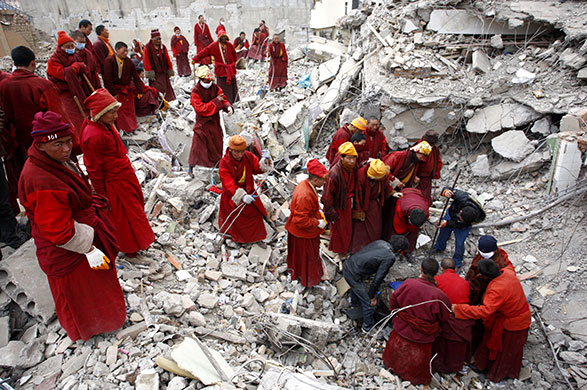 China earthquake: Monks and ethnic Tibetans search for survivors in Gyegu