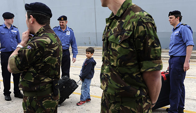 Stranded passengers: A British child waits before boarding HMS Albion 
