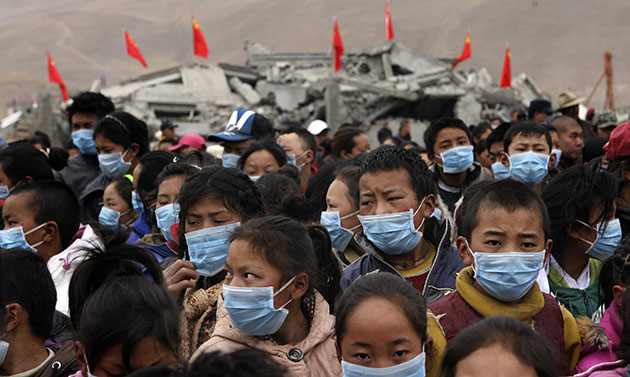 china quake mourning: Yushu: Young children wearing masks gather to commemorate those killed 