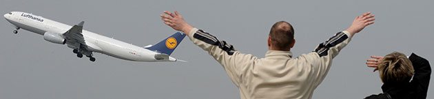 Airspace reopens: Relatives of flight passengers wave to a Lufthansa plane