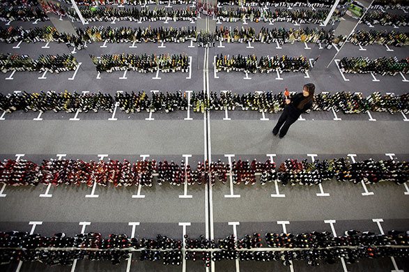 24 hours in pictures: London, UK: A judge selects a bottle of wine for tasting