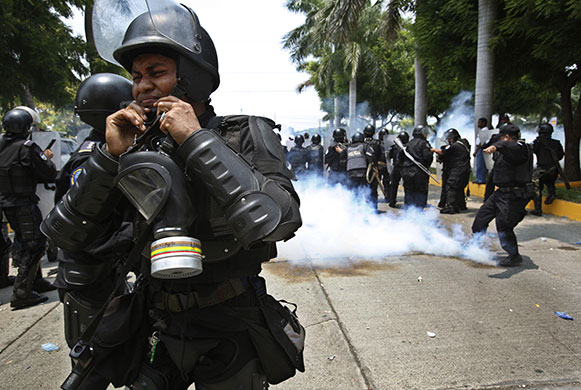 24 hours in pictures: Managua, Nicaragua: Riot police during a protest