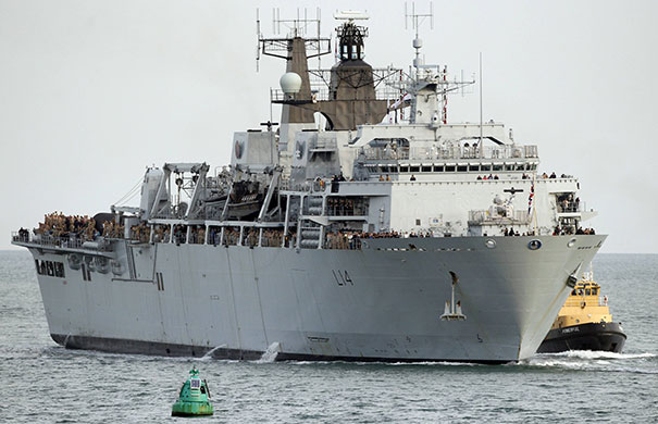 Return of the Albion: Civilians and members of several military units arrive home on HMS Albion