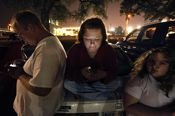 Deepwater Horizon oil rig: the family of a crew member use their PDAs to keep abreast of events