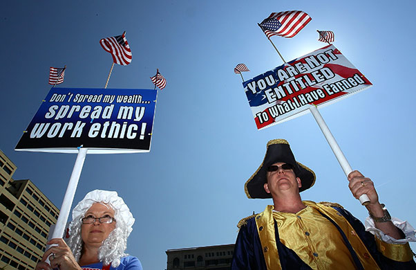 Week in Business: People in constume participate in a Tea Party Protest in Washington, DC