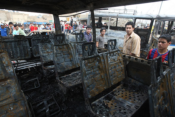 Baghdad bombings: The shell of a bus burned in the bomb
