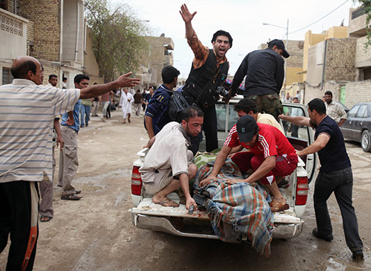 Baghdad bombings: A victim is evacuated