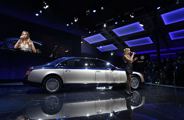 Beijing car show: Leona Lewis performs while standing next to a Daimler Maybach