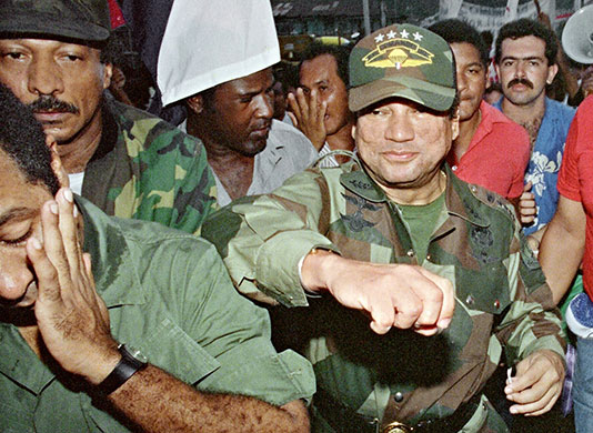 Manuel Noriega: 2 May 1989: General Manuel Antonio Noriega fakes a punch to a supporter